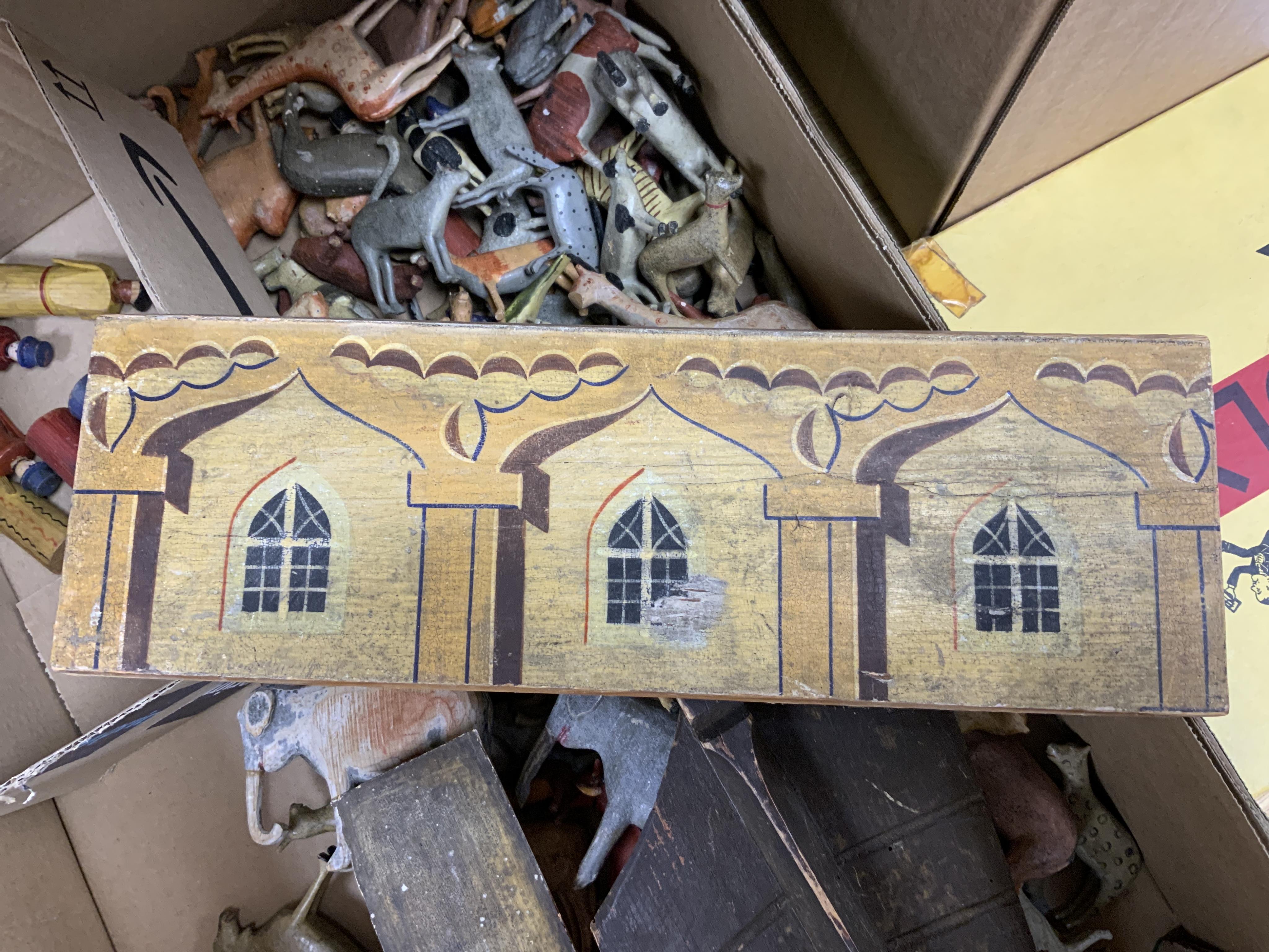 A 19th century German Erzgebirge pine painted Noah's Ark together with a good quantity of carved and painted wooden animals, the ark decorated with trompe l’oeil architectural features, geometric patterns, Gothic windows